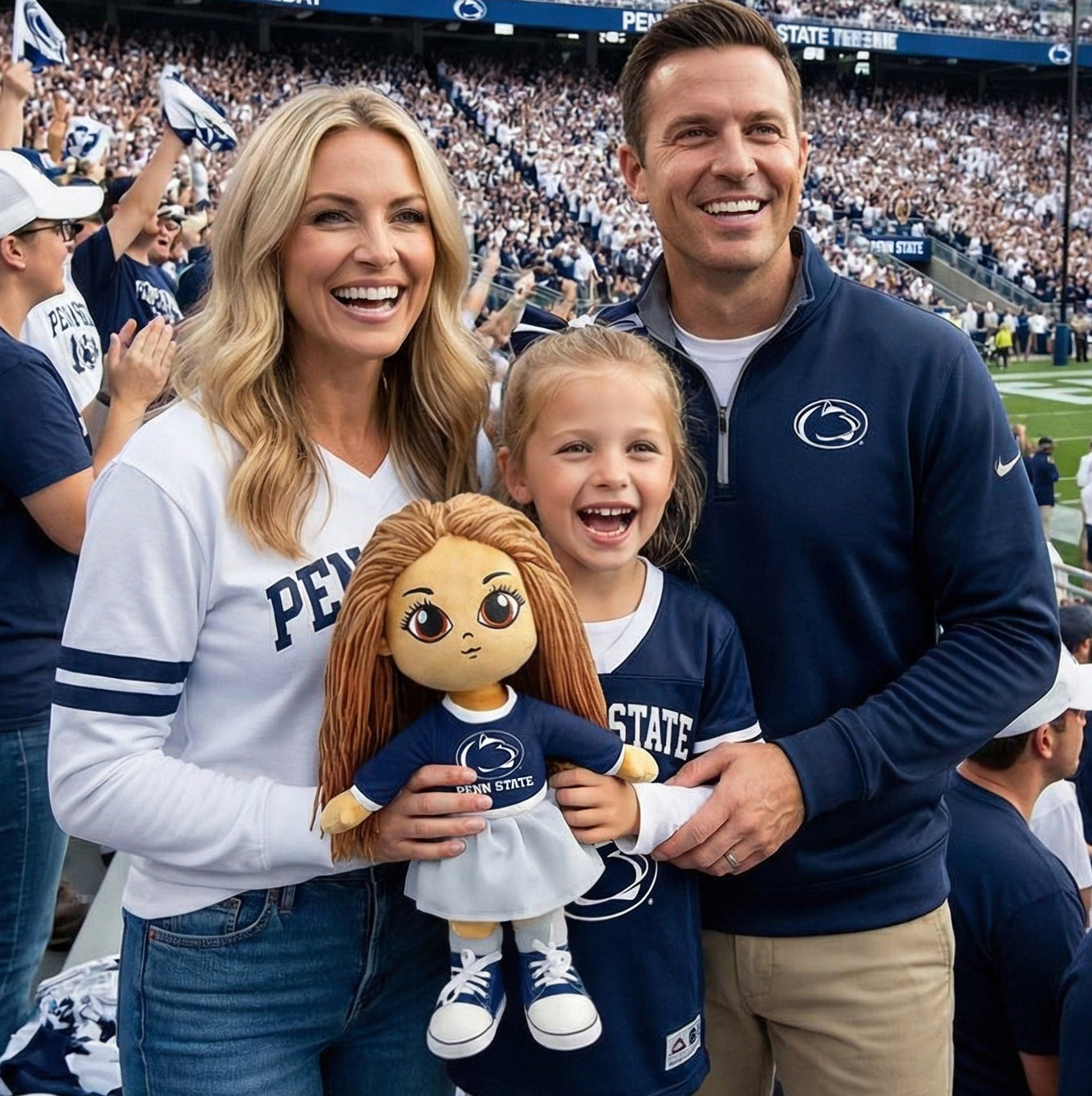 Family at a Penn State football game holding a doll